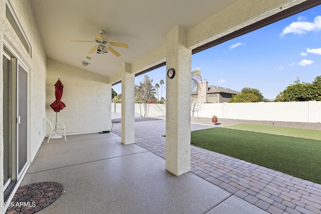 view of patio with ceiling fan and a fenced backyard