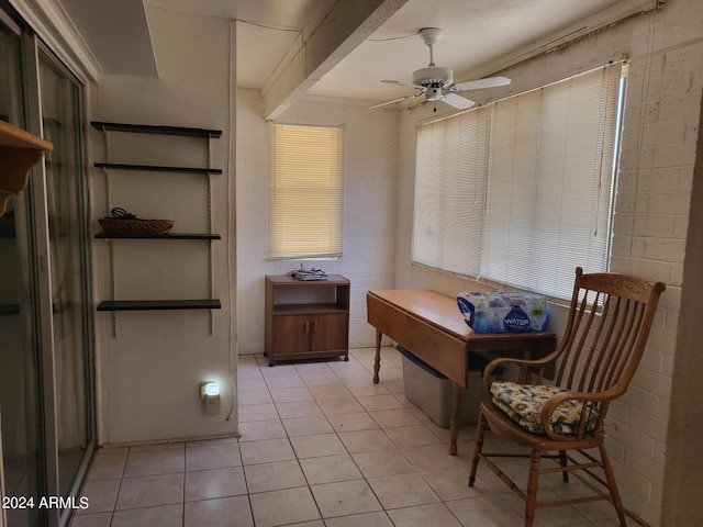 interior space featuring ceiling fan and light tile patterned flooring