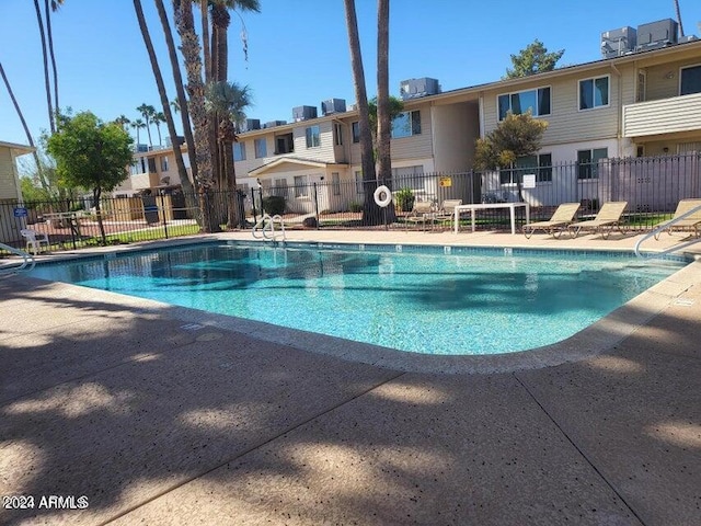 view of swimming pool featuring a patio area