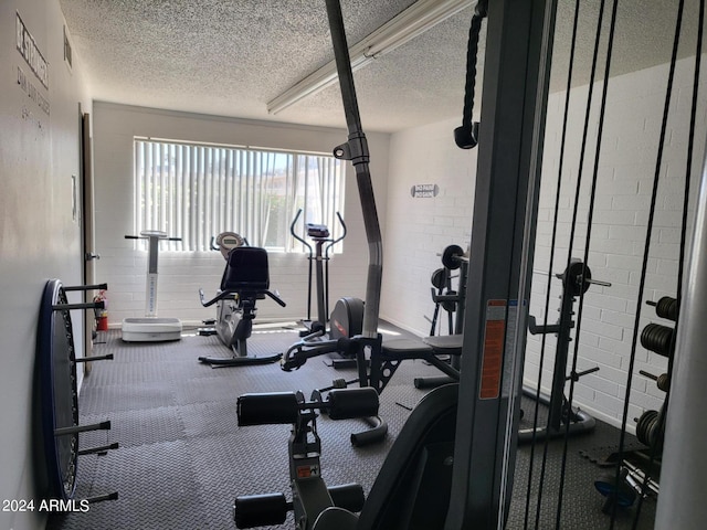 exercise area with a textured ceiling