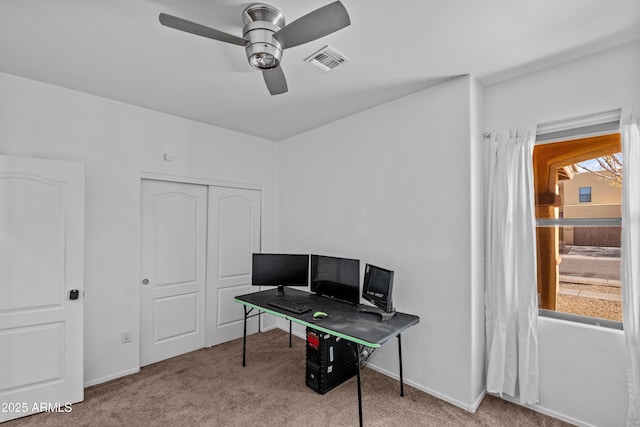 home office featuring ceiling fan, light colored carpet, and plenty of natural light