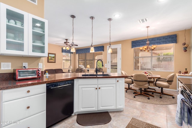 kitchen featuring dishwasher, white cabinetry, sink, decorative light fixtures, and a healthy amount of sunlight