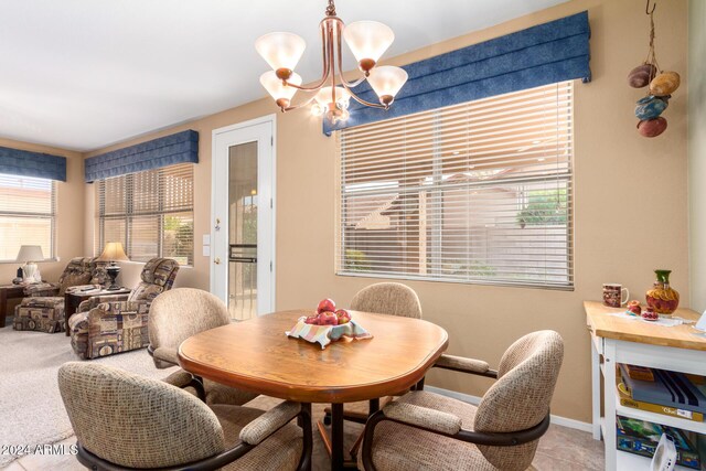 dining area featuring a chandelier