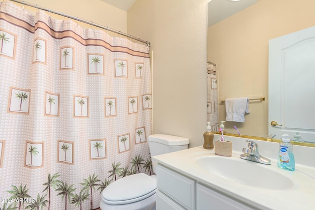 bathroom featuring toilet, walk in shower, and vanity