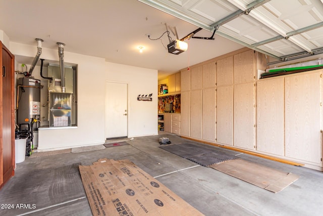 garage featuring a garage door opener and water heater