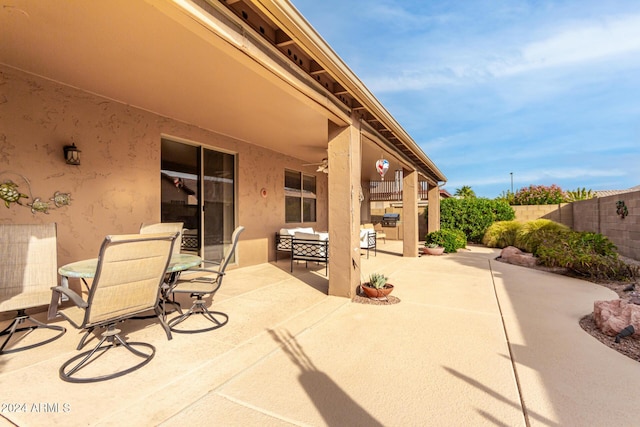 view of patio featuring ceiling fan