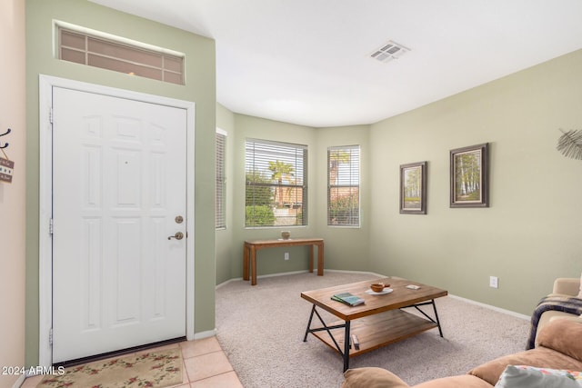 entrance foyer with light tile patterned floors