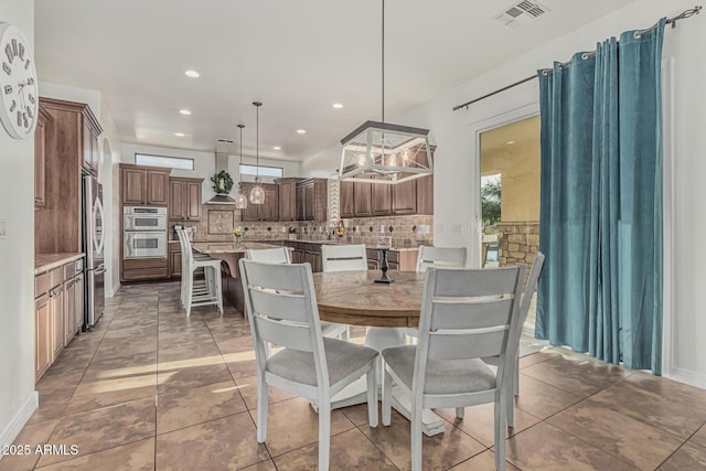dining area with recessed lighting