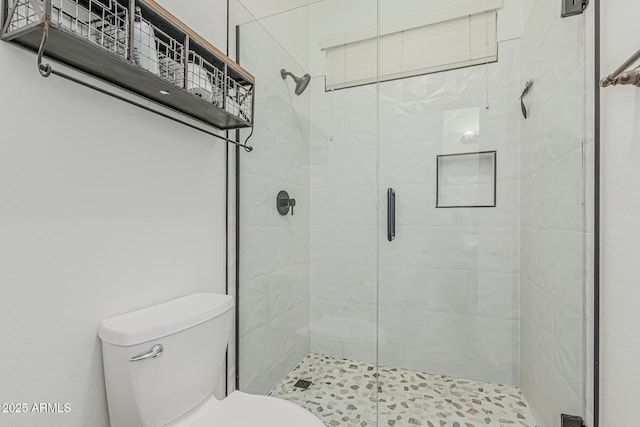full bath with toilet and a shower stall