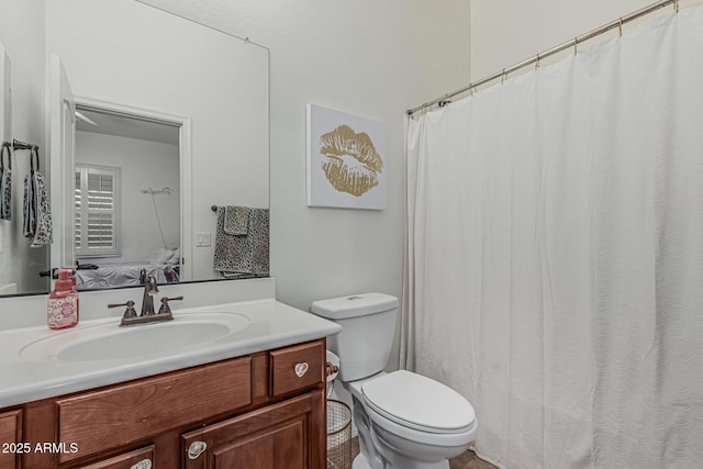 bathroom with toilet and vanity