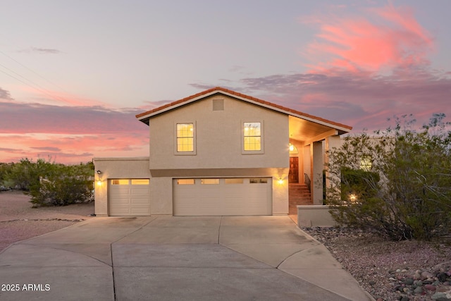 15247 N Pelican Dr, Fountain Hills, AZ 85268 - view of front of house featuring stucco siding, driveway, and a garage