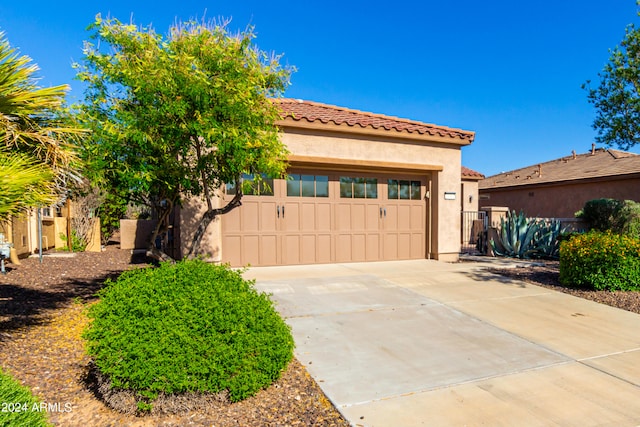 mediterranean / spanish house featuring a garage