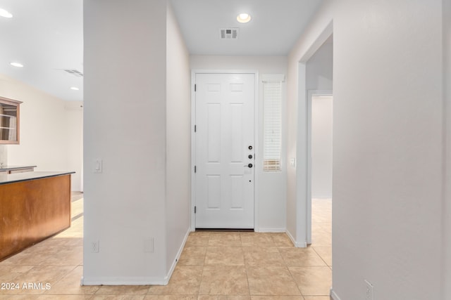 entryway with light tile floors