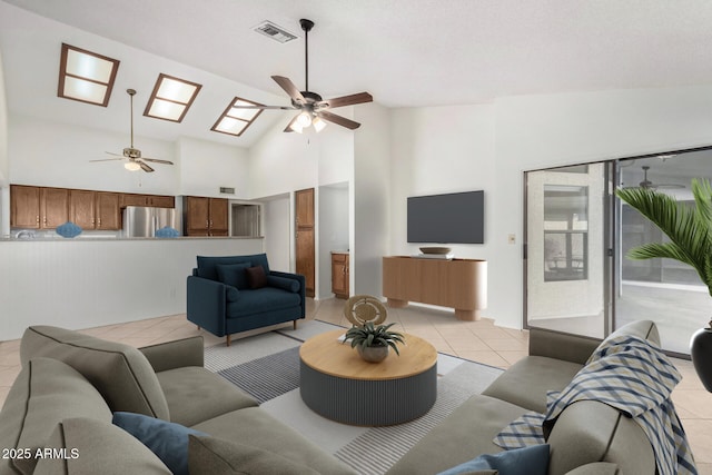 tiled living room with high vaulted ceiling