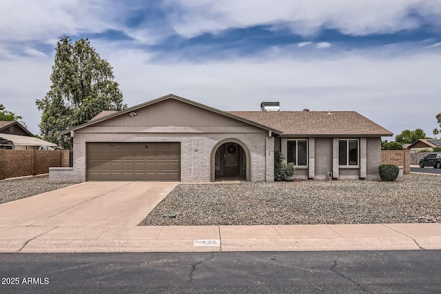 828 E Le Marche Ave, Phoenix, AZ 85022 - view of front of home with fence, an attached garage, and concrete driveway