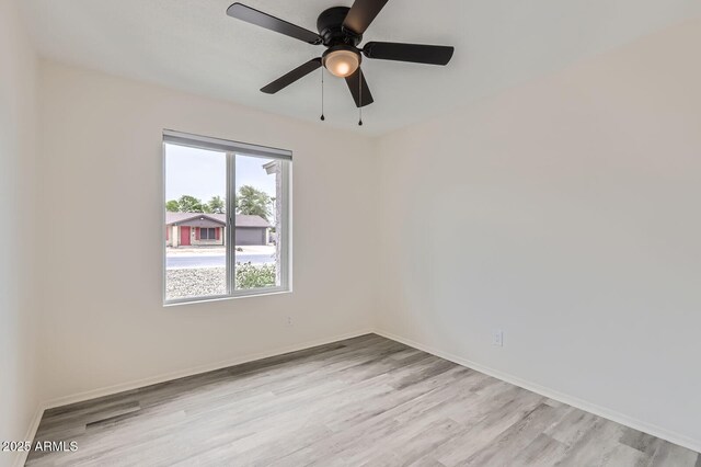 828 E Le Marche Ave, Phoenix, AZ 85022 - spare room with light wood finished floors, baseboards, and a ceiling fan