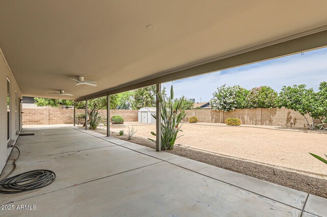 828 E Le Marche Ave, Phoenix, AZ 85022 - view of patio with a storage unit, a ceiling fan, an outdoor structure, and a fenced backyard
