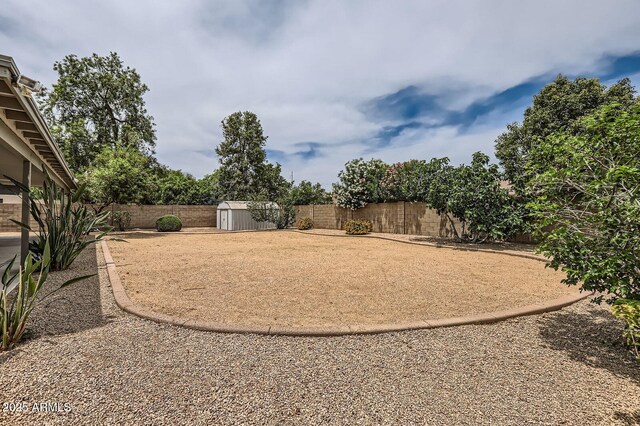 828 E Le Marche Ave, Phoenix, AZ 85022 - fenced backyard featuring a shed and an outdoor structure