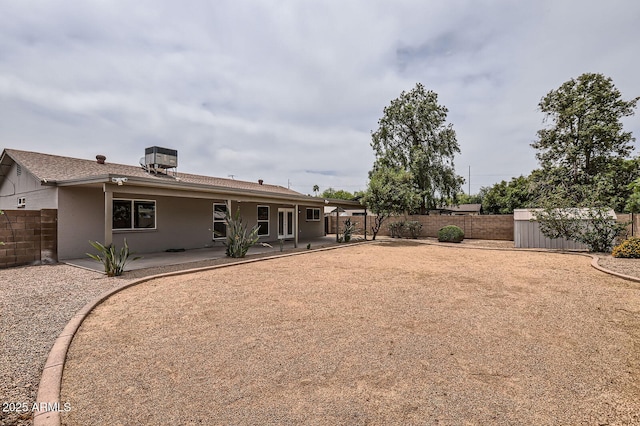 828 E Le Marche Ave, Phoenix, AZ 85022 - rear view of property with a patio, a storage unit, a fenced backyard, an outbuilding, and central air condition unit