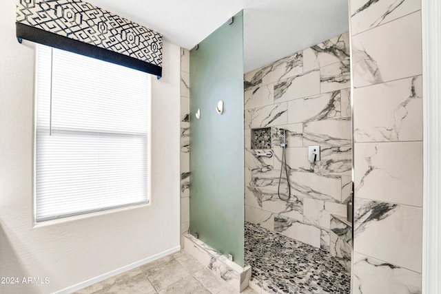 bathroom featuring tiled shower