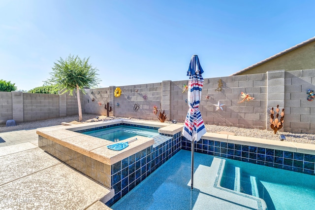 view of pool with a fenced in pool, an in ground hot tub, and a fenced backyard