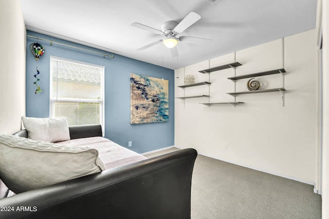 living room featuring ceiling fan and carpet