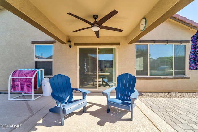 view of patio featuring ceiling fan