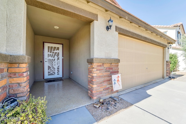 entrance to property featuring a garage