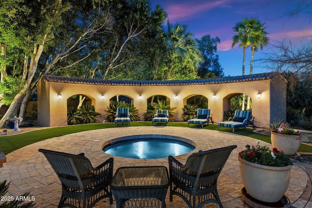 view of swimming pool featuring an outdoor hot tub and a patio area