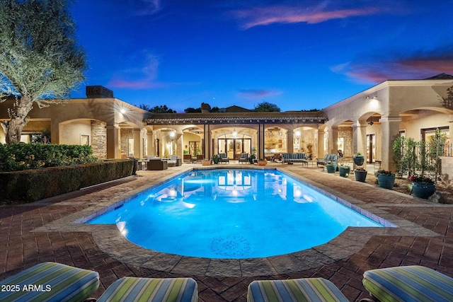 outdoor pool featuring a ceiling fan, outdoor lounge area, and a patio area