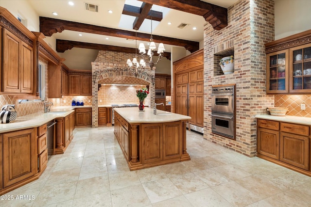 kitchen with visible vents, brown cabinets, appliances with stainless steel finishes, and light countertops