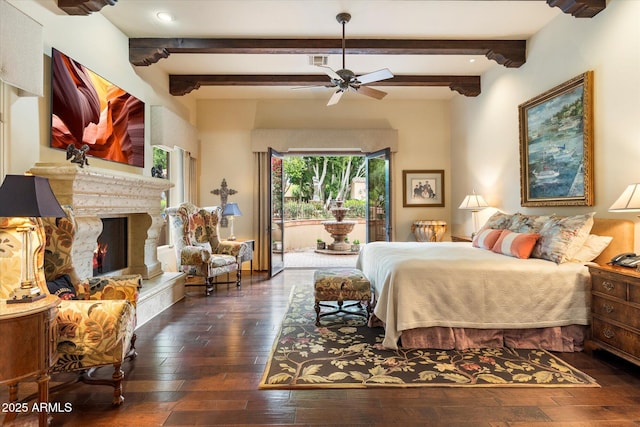 bedroom with beamed ceiling, visible vents, access to outside, a high end fireplace, and wood-type flooring