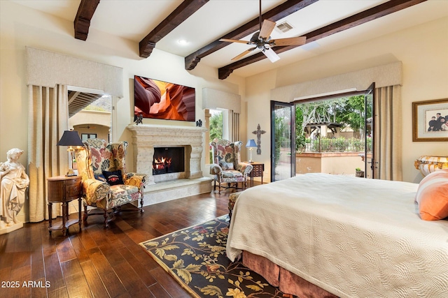 bedroom with a high end fireplace, visible vents, beamed ceiling, hardwood / wood-style flooring, and access to outside