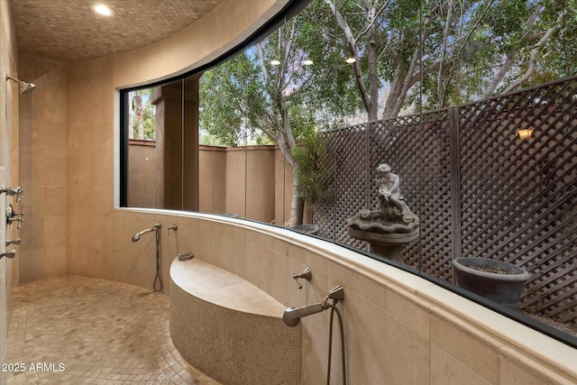 bathroom with a tile shower