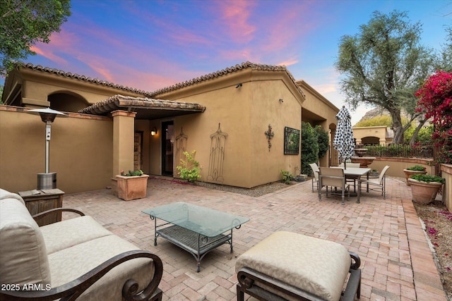 patio terrace at dusk with outdoor dining space