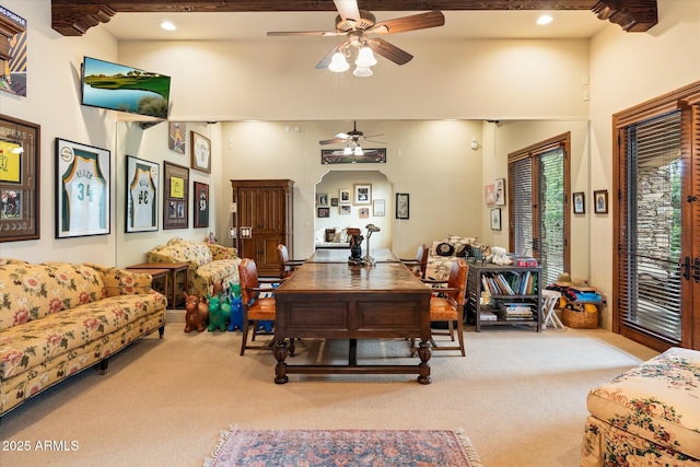 carpeted dining room featuring beam ceiling, recessed lighting, a high ceiling, and ceiling fan