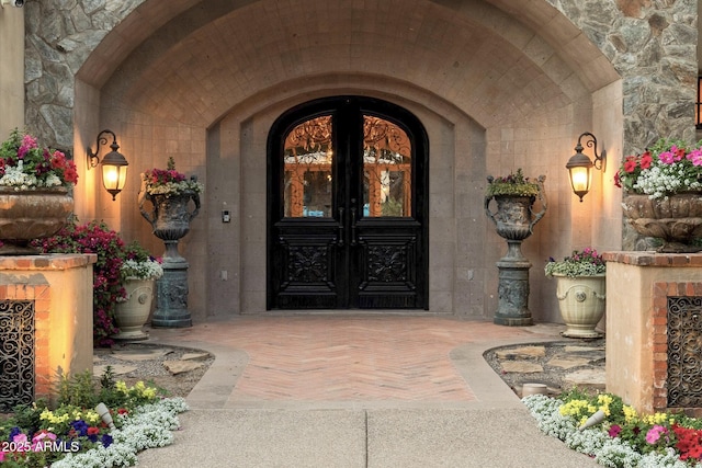 doorway to property with stone siding