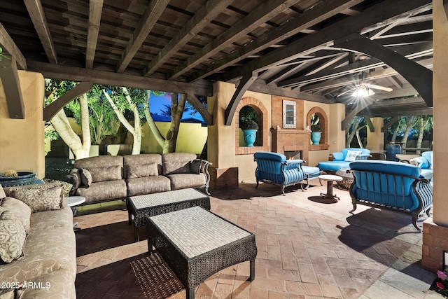 view of patio / terrace featuring an outdoor living space with a fireplace