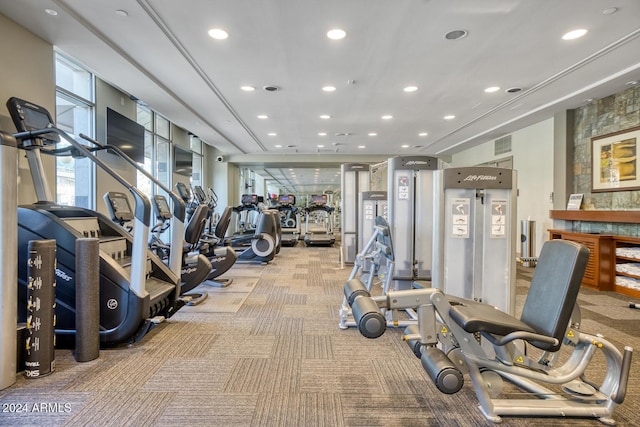 workout area featuring recessed lighting, visible vents, and light colored carpet