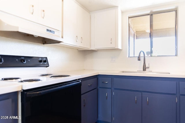 kitchen with under cabinet range hood, blue cabinets, a sink, light countertops, and electric range