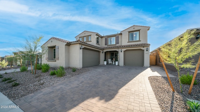 mediterranean / spanish-style home featuring a garage