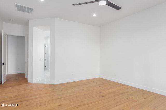 unfurnished room with light wood-type flooring and ceiling fan