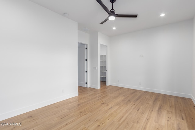 spare room with light hardwood / wood-style flooring and ceiling fan