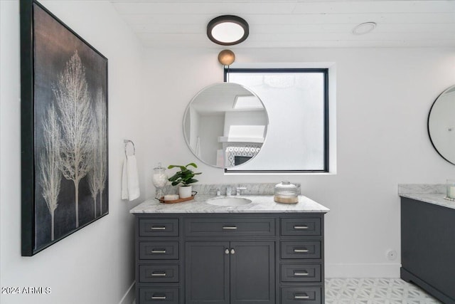 bathroom featuring tile flooring and vanity