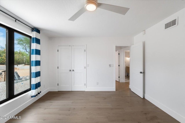 spare room featuring ceiling fan and hardwood / wood-style floors