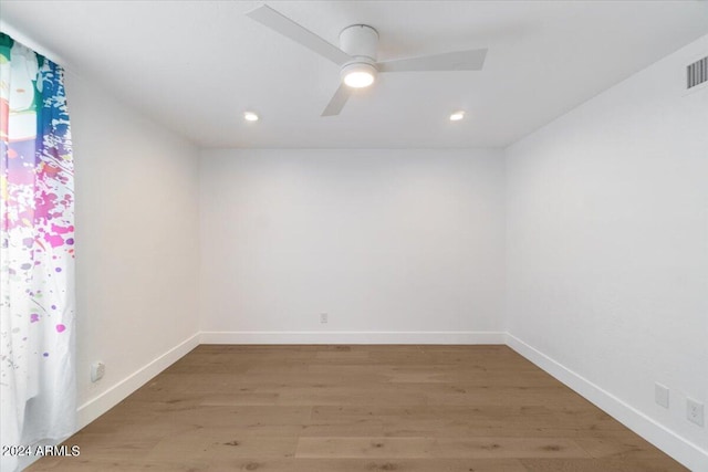 spare room featuring ceiling fan and wood-type flooring