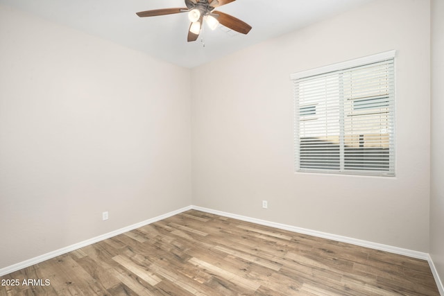 spare room with light hardwood / wood-style floors and ceiling fan