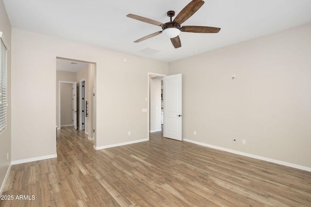 spare room with ceiling fan and light hardwood / wood-style flooring