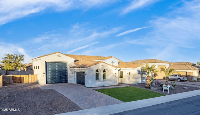 mediterranean / spanish-style home featuring a garage