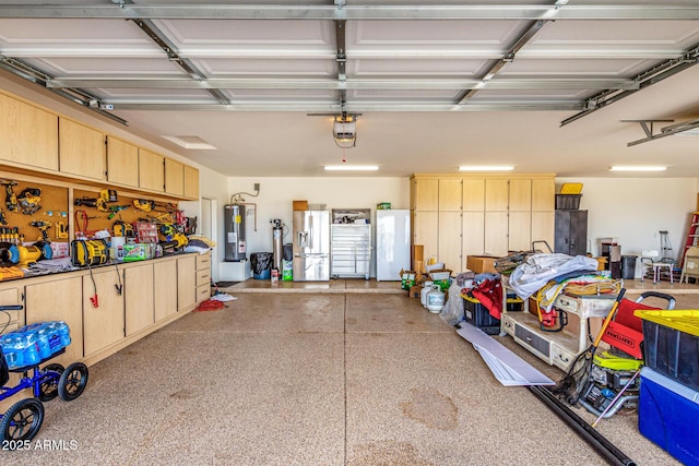 garage with a garage door opener, freestanding refrigerator, and water heater